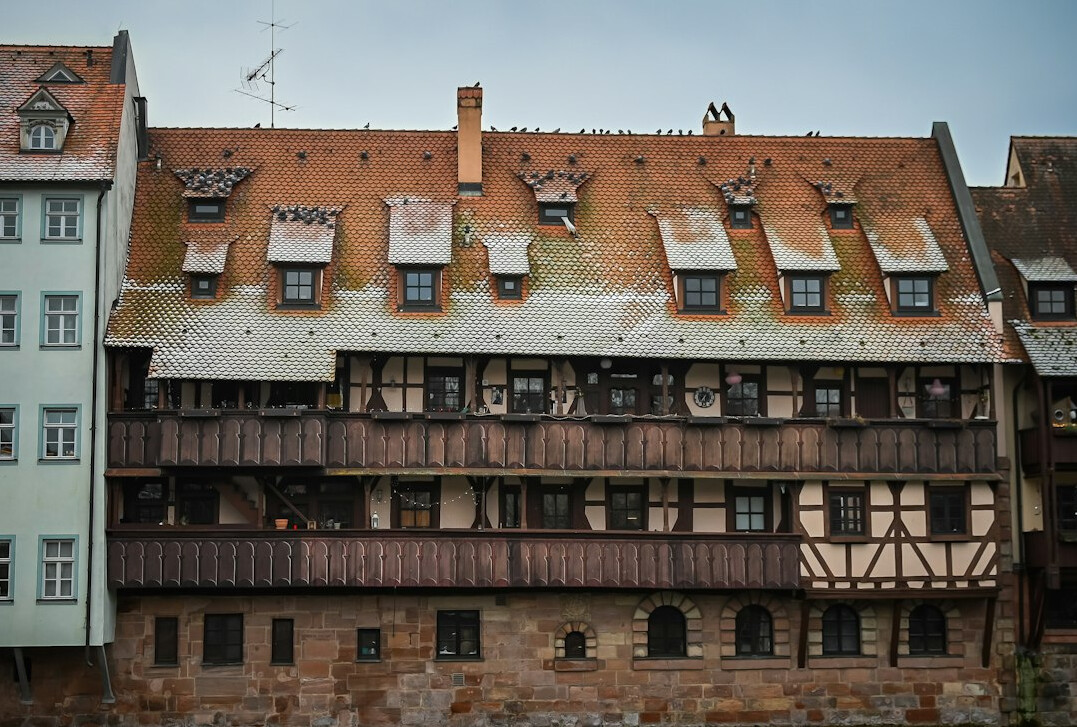 Half-timbered old town house facade in Nuremberg under a winter sky